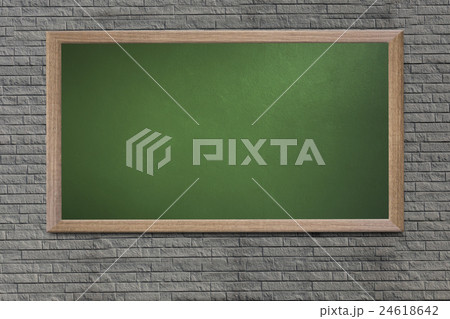 Blank old school blackboard on a grunge wall. 24618642