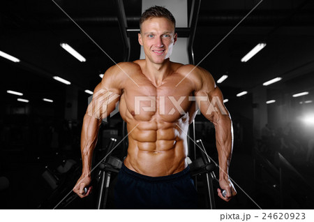 athletic man fitness model showing six pack abs 24620923