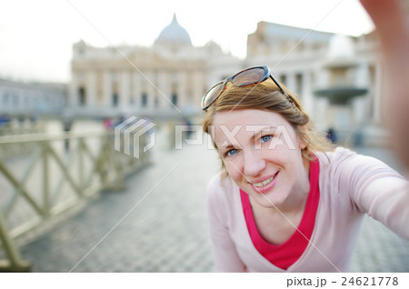 Beautiful young woman taking a picture of herself in Vatican Beautiful young woman taking a picture of herself in Vatican 24621778