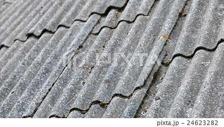 Old gray corrugated fibre cement roofing 24623282