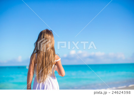 Back view of adorable little girl at white beach Back view of adorable little girl at white beach 24624398