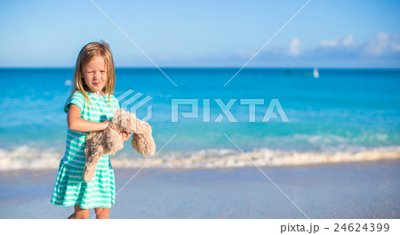 Adorable little girl with her bunny toy on 24624399