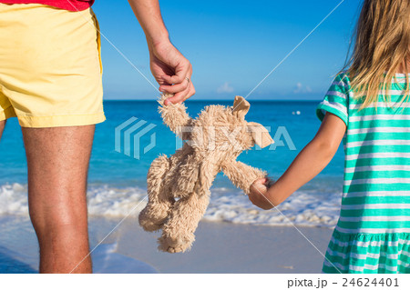 Young father with little daughter holding bunny 24624401