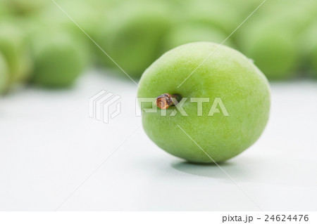 Green plum korean fruits on a white Green plum korean fruits on a white 24624476