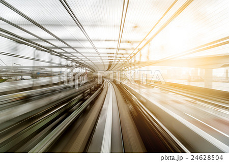 Light trail from moving train during evening 24628504