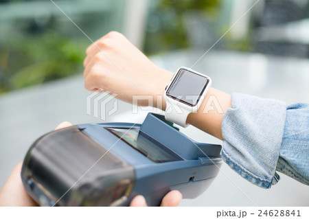 Customer using smart watch to pay Customer using smart watch to pay 24628841