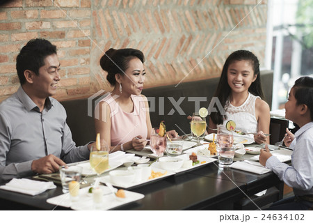 Chatting and eating 24634102
