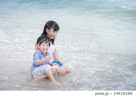 asian children playing on the beach 24638386