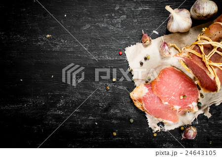 Sliced ham with spice and garlic. 24643105