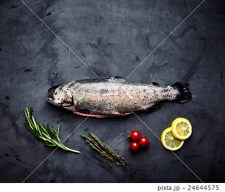 Raw trout, rosemary, tomatoes, lemon 24644575