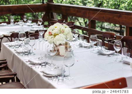 Floral arrangement of white flowers at the wedding Floral arrangement of white flowers at the wedding 24645783