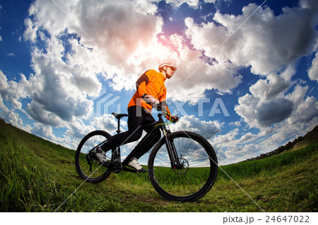 Cyclist in red sport equipment and helmet 24647022