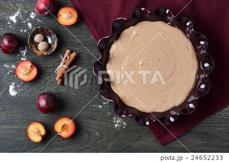 Plum pie cooking 24652233