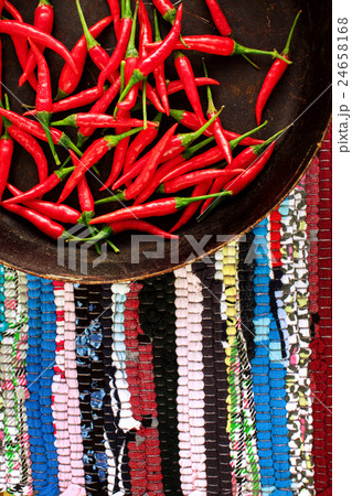 Red chili peppers on striped background 24658168