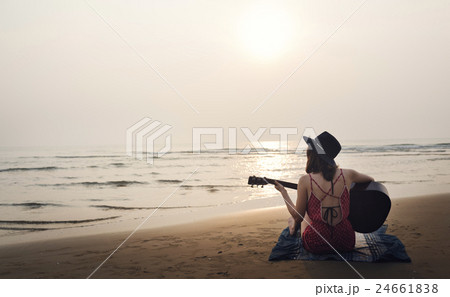 Guitar Playing Girl Beach Relaxation Song Music Concept Guitar Playing Girl Beach Relaxation Song Music Concept 24661838