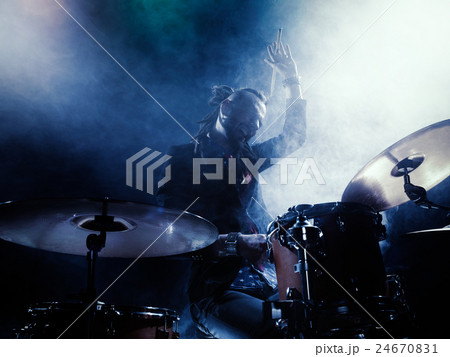 Silhouette of the drummer on stage. 24670831