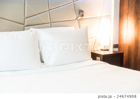 White pillow on bed 24674908