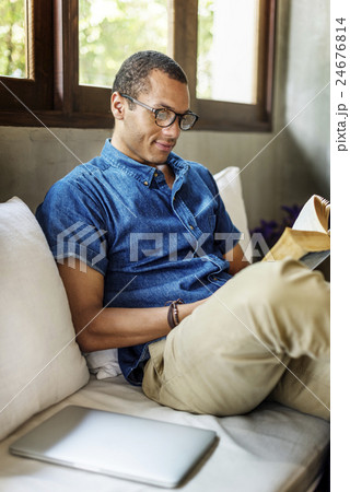 Attractive Young Man Reading Concept 24676814