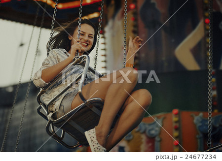Woman Carnival Ride Riding Happiness Fun Concept Woman Carnival Ride Riding Happiness Fun Concept 24677234