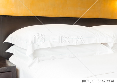 White pillow on bed 24679938