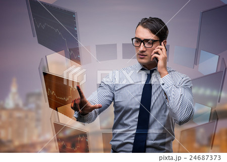 Young trader talking on the phone Young trader talking on the phone 24687373