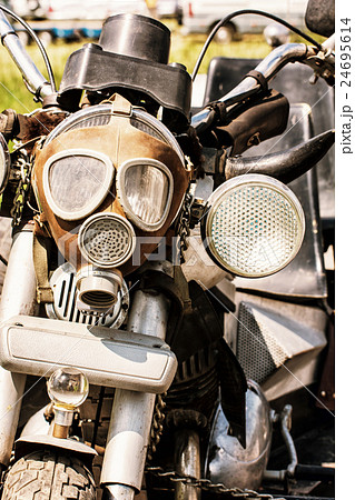 Detail of veteran motorbike with symbolic gas mask Detail of veteran motorbike with symbolic gas mask 24695614