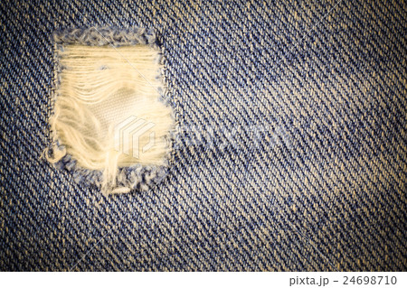 Vintage jeans torn denim background. Vintage jeans torn denim background. 24698710
