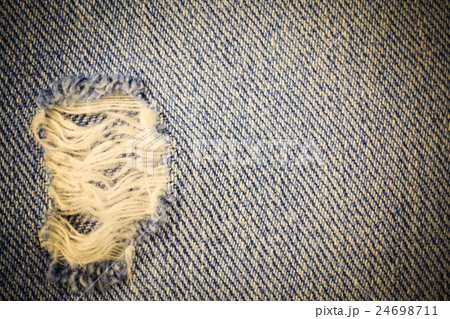 Vintage jeans torn denim background. Vintage jeans torn denim background. 24698711