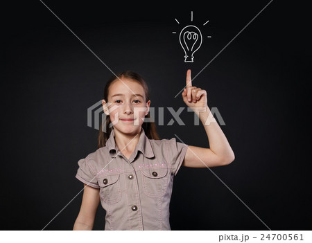 Small girl has idea. Child shows finger up, eureka 24700561