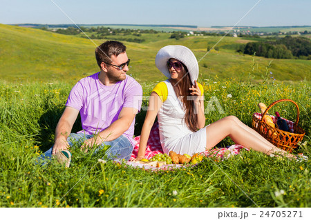 Young couple having picnic 24705271