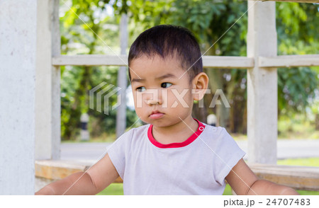 Portrait of a happy little boy in the park Portrait of a happy little boy in the park 24707483