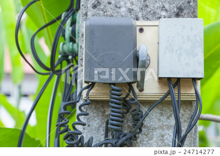 Box of telephone line attached to the pole. Box of telephone line attached to the pole. 24714277