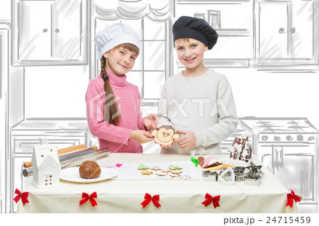 Children making christmas cookies Children making christmas cookies 24715459