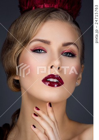 Beautiful girl with red makeup 24715763
