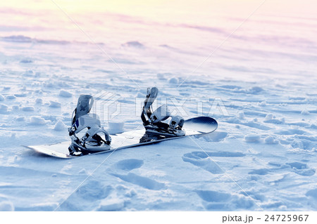 Snowboarding in the snow at sunset 24725967