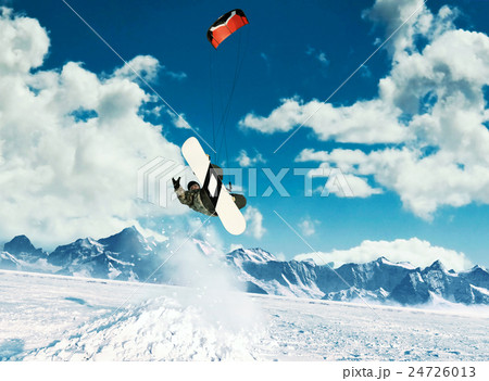 Young men, ride snowboarding on frozen lake in the 24726013