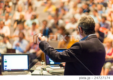 Public speaker giving talk at Business Event. Public speaker giving talk at Business Event. 24727174