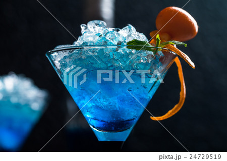 Blue cocktail in martini glasses 24729519
