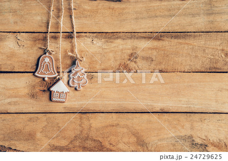 Christmas decoration hanging on wood background Christmas decoration hanging on wood background 24729625