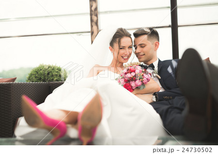 Beautiful couple, bride and groom posing on Beautiful couple, bride and groom posing on 24730502