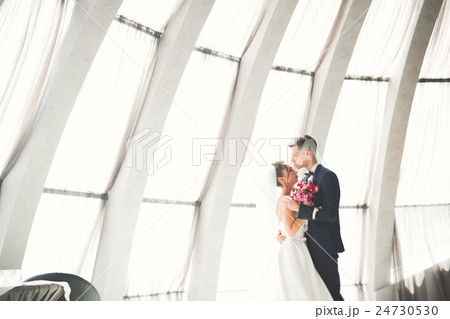 Beautiful couple, bride and groom posing on 24730530