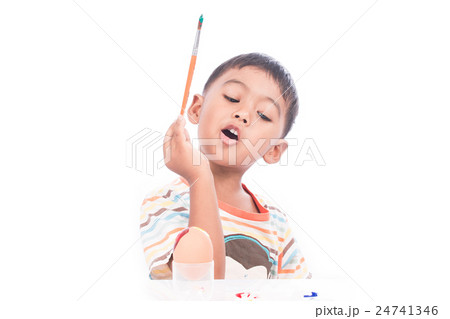 little boy painting easter egg little boy painting easter egg 24741346