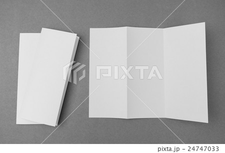 Trifold white template paper on gray background . Trifold white template paper on gray background . 24747033