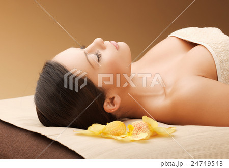 woman in spa salon lying on the massage desk woman in spa salon lying on the massage desk 24749543