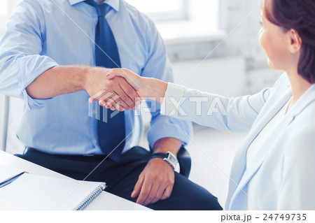 business people shaking hands in office 24749735