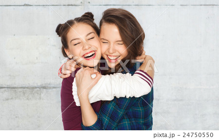 happy smiling pretty teenage girls hugging happy smiling pretty teenage girls hugging 24750550