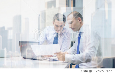 two businessmen having discussion in office two businessmen having discussion in office 24751477