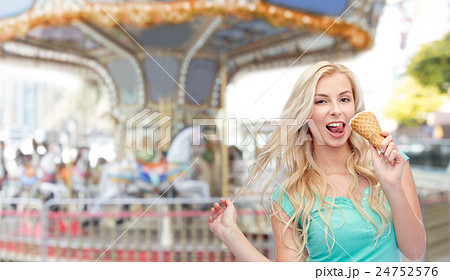 happy young woman in sunglasses eating ice cream happy young woman in sunglasses eating ice cream 24752576