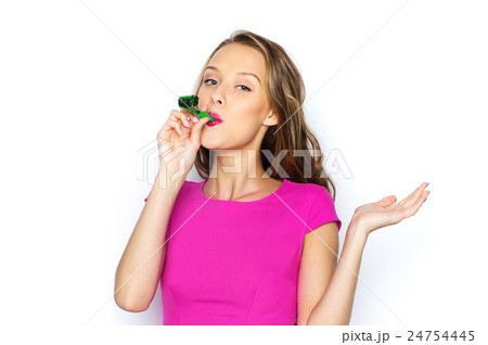 happy young woman or teen girl with party horn 24754445