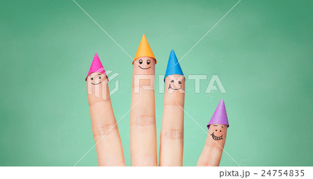 close up of hand with four fingers in party hats 24754835
